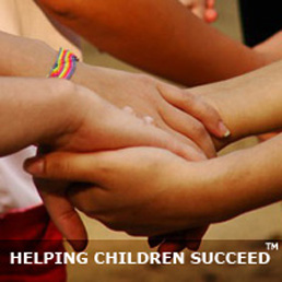 Photo showing holding hands: Helping Children Together.