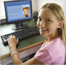 Photo showing a girl working with Dynaread on the computer.